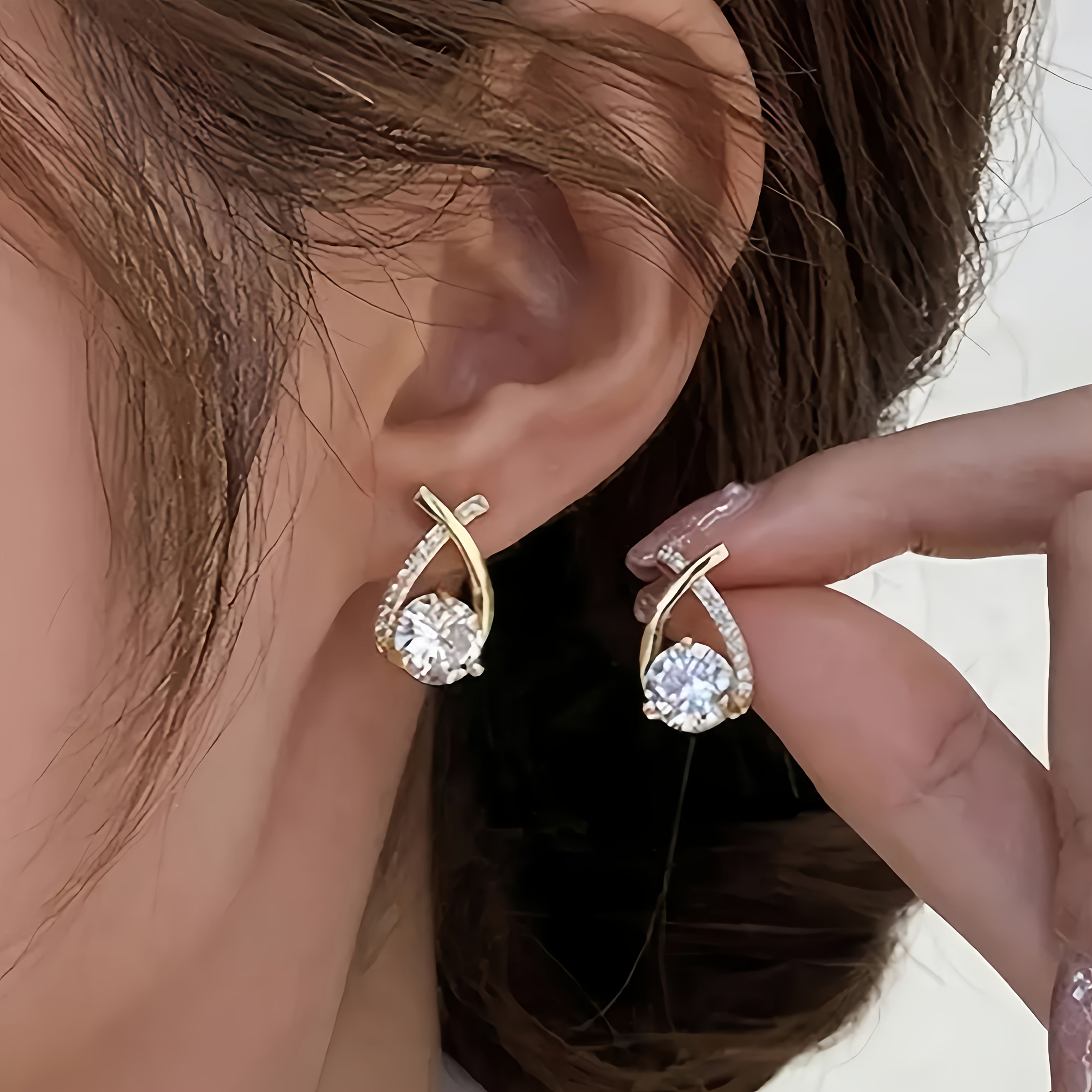 Oorbellen met gouden kruis en zirkonia